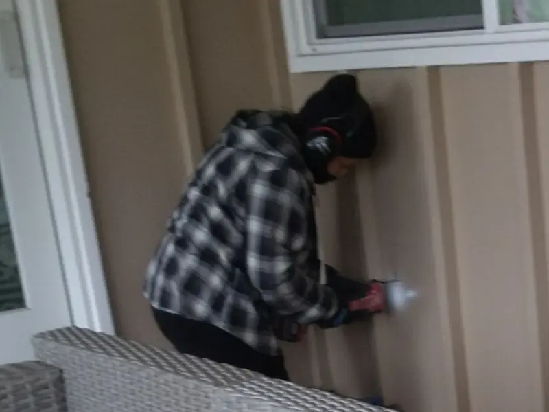 Professional electrician installing an exterior outlet in Van Alstyne
